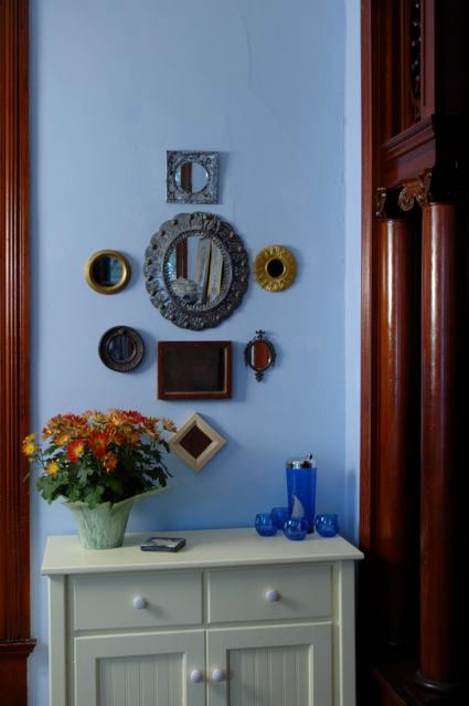 Put your collections on display. A "gallery wall" of framed mirrors creates an attractive focal point.